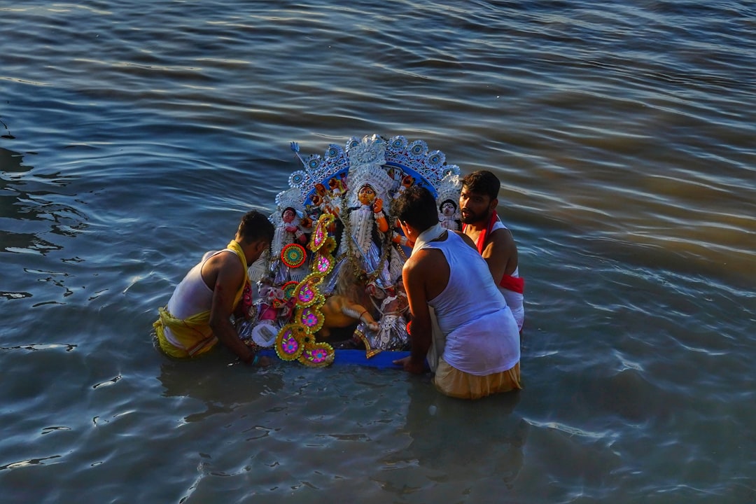 a group of people in the water,