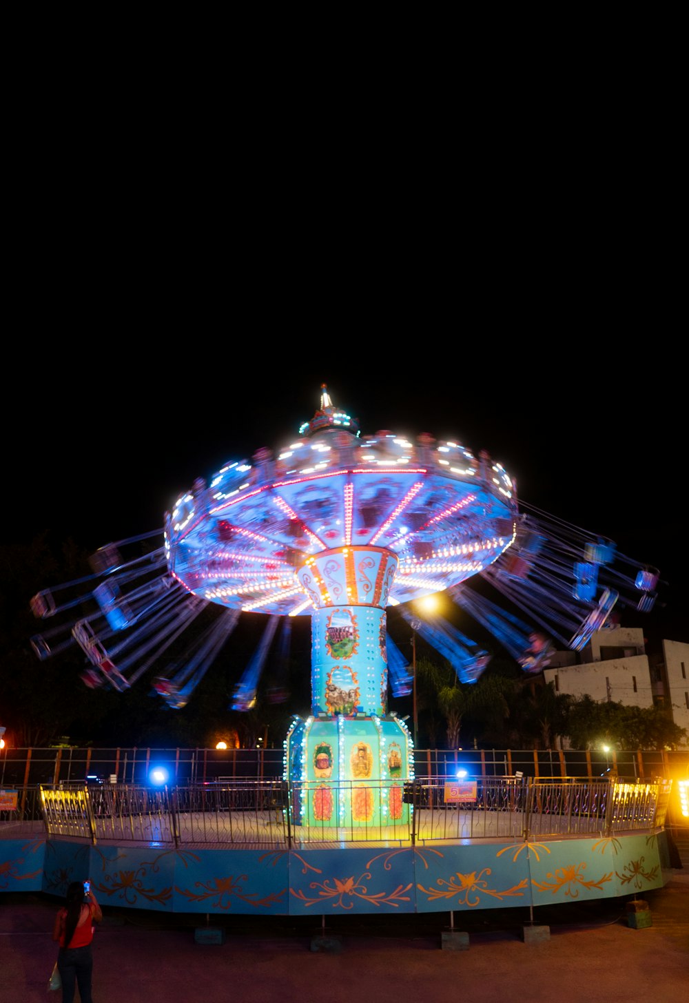 a ferris wheel lit up at night