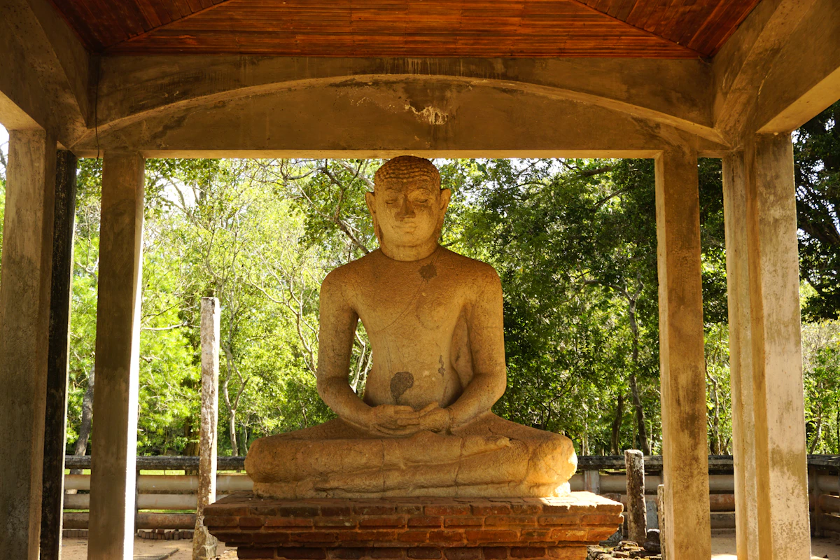 Ancient Buddha statue in the sacred city of Anuradhapura