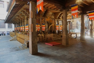 a building with pillars and flags