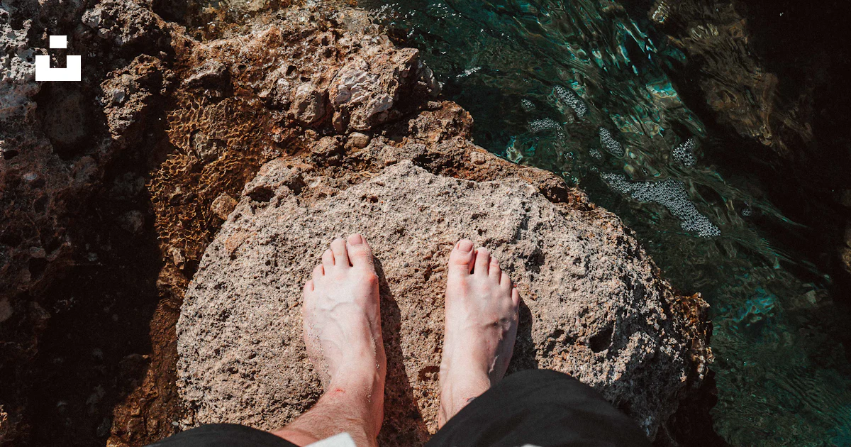 Feet on a rock photo – Free Balos beach Image on Unsplash