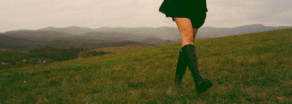 a person running on a grass field