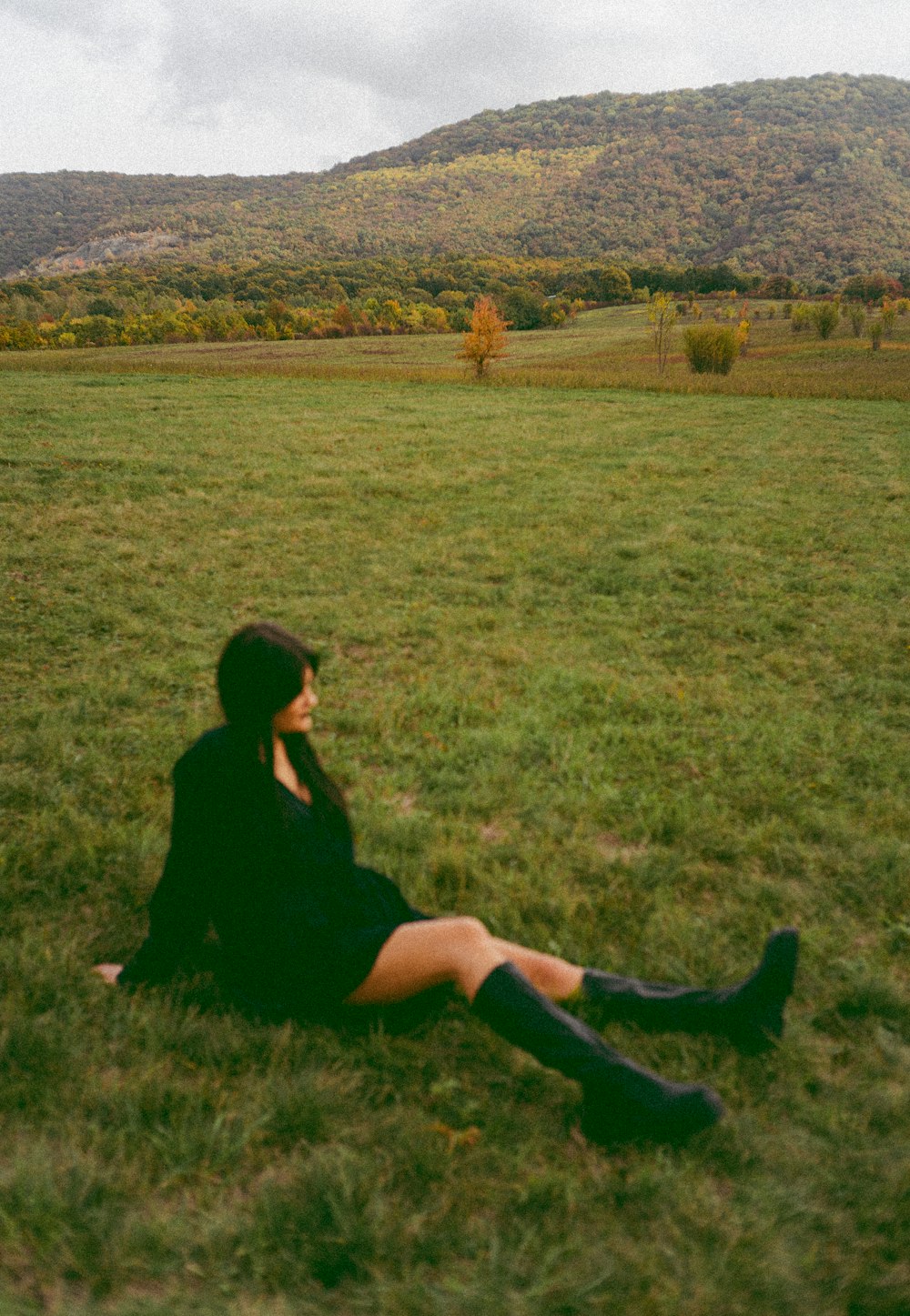 a person sitting on grass