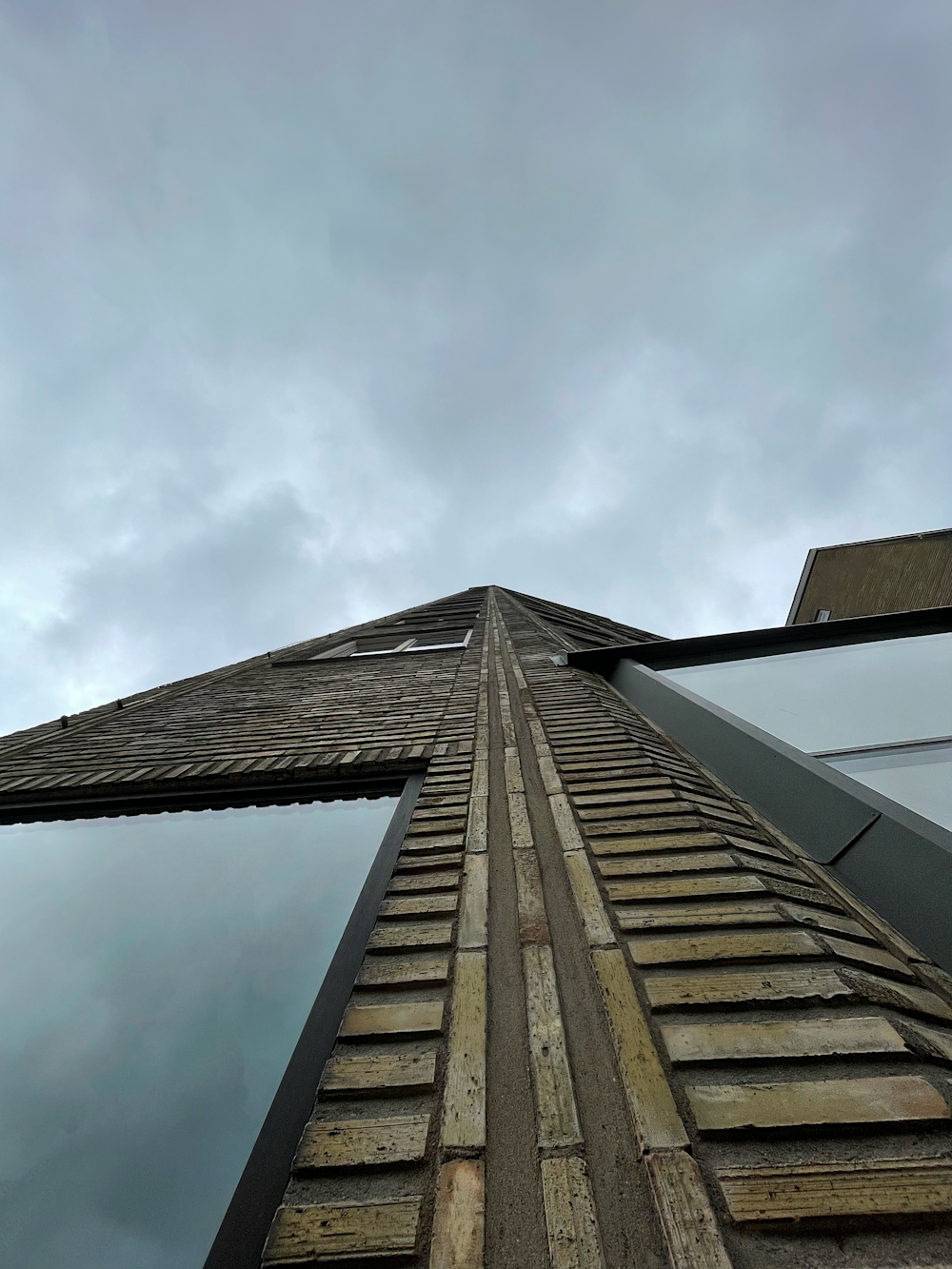 a building with a cloudy sky