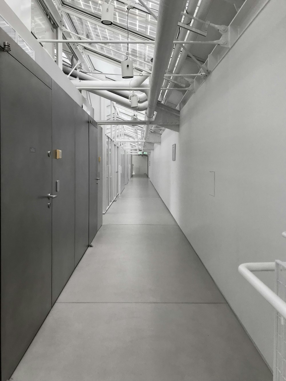 a long hallway with metal doors