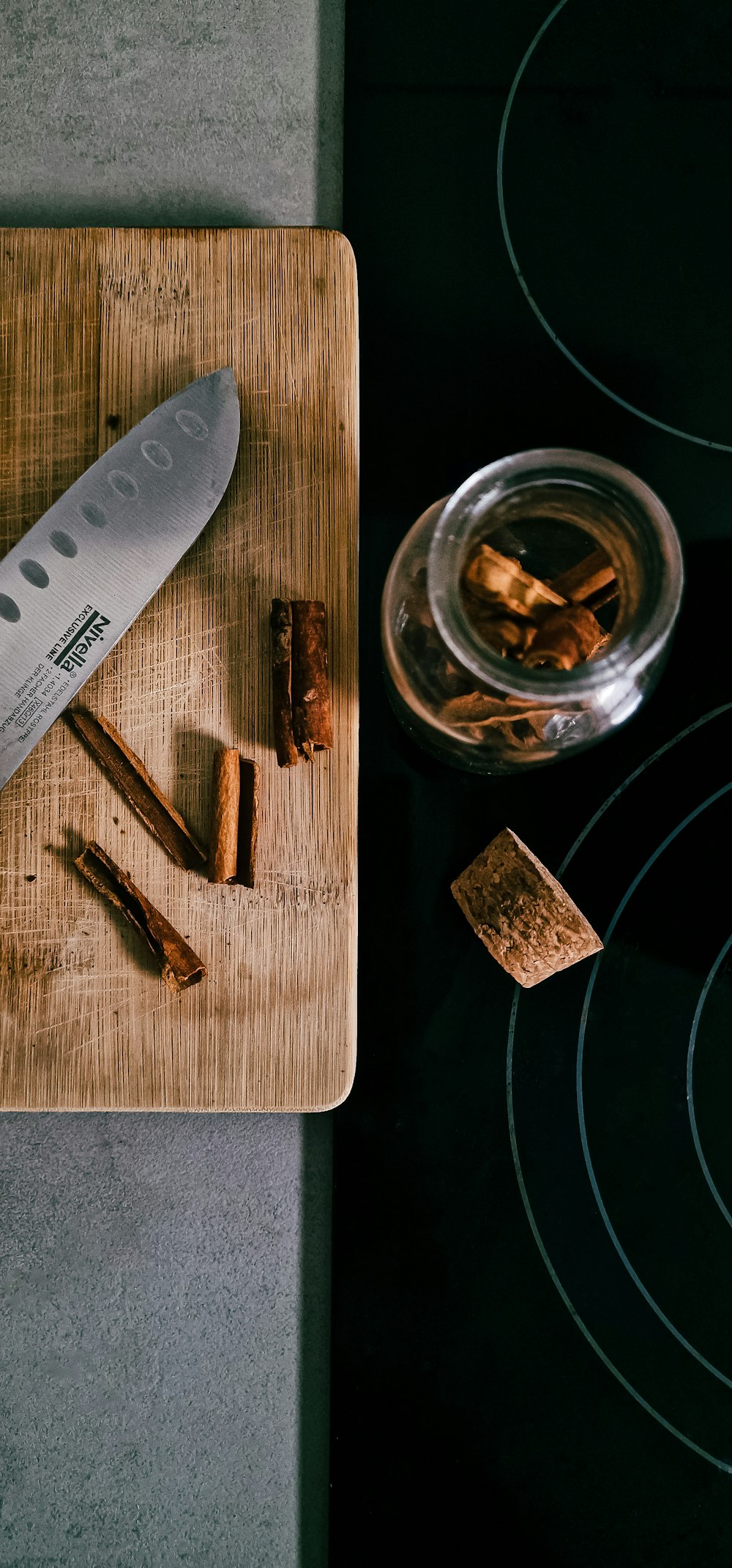 a wood cutting board with a small piece of wood on it