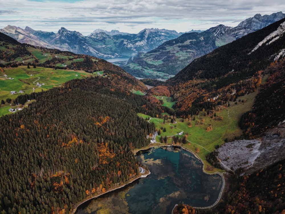 a river running through a valley between mountains