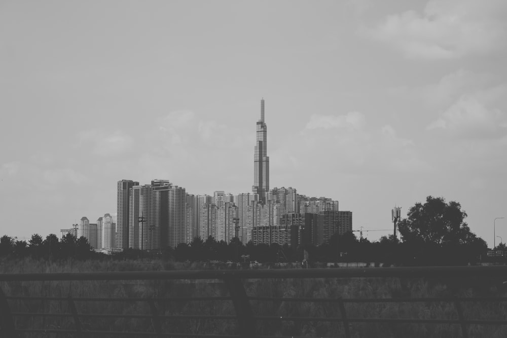 a city skyline with a tall building