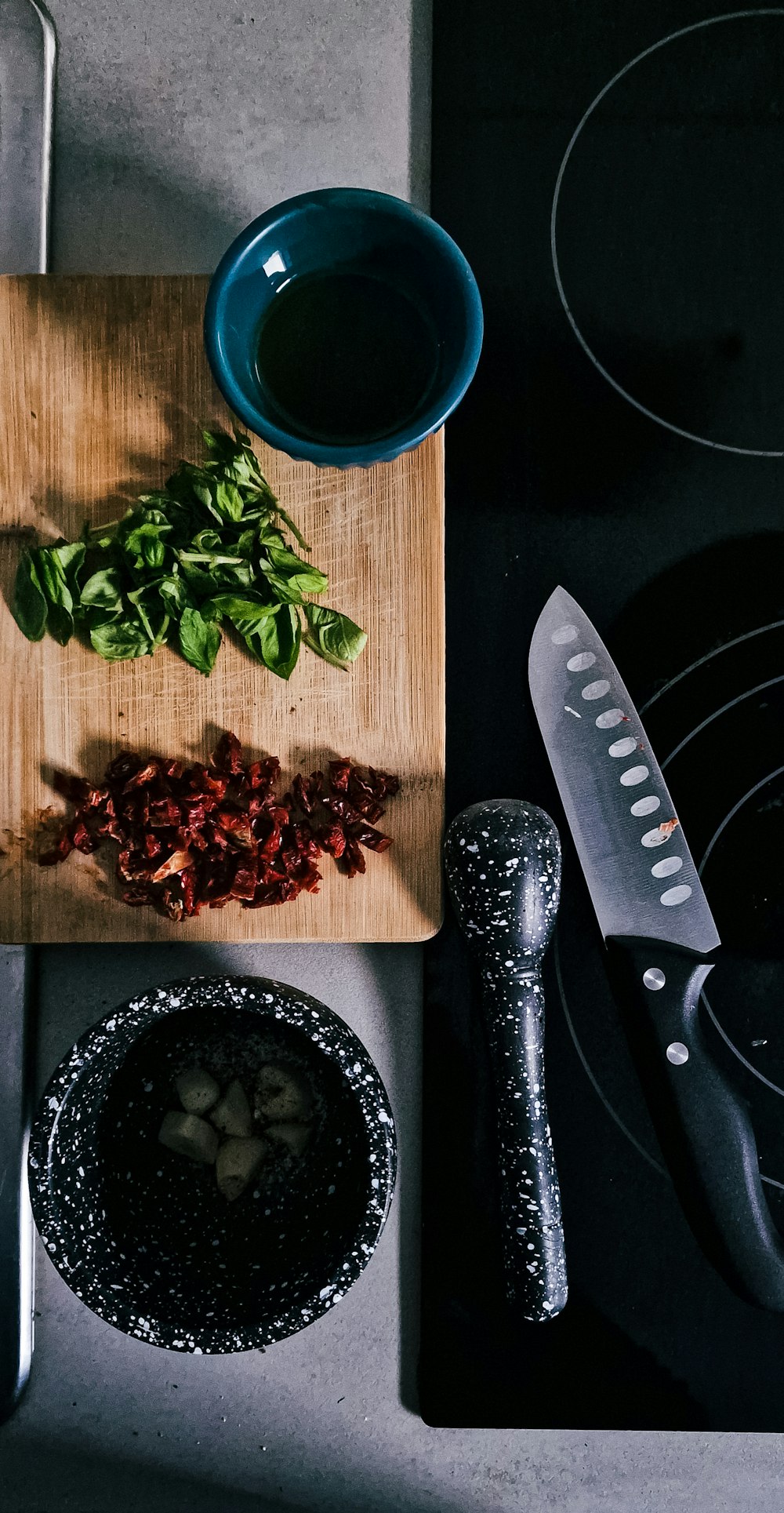 a table with a bowl of food and a knife