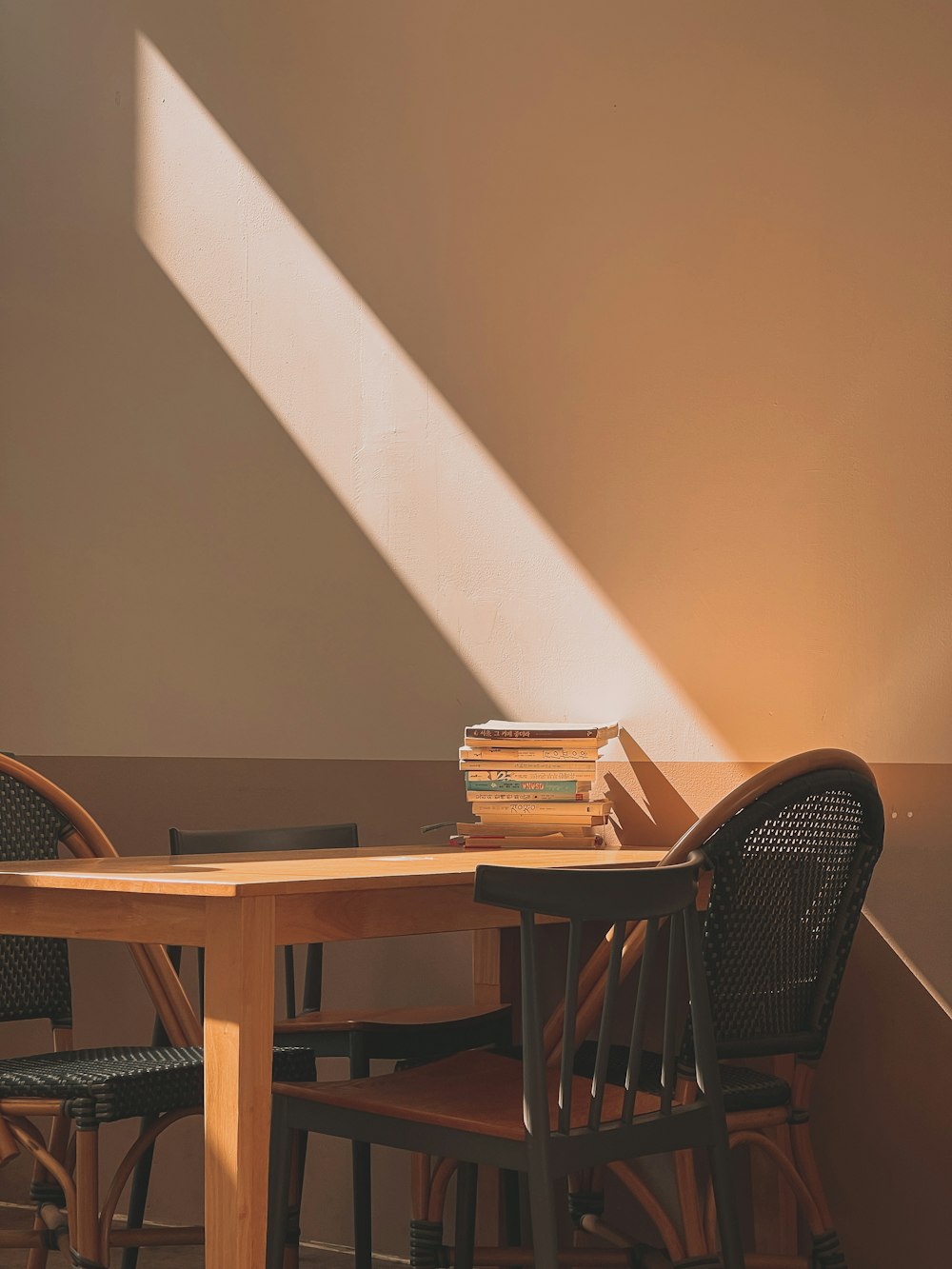 a table with chairs and a white umbrella