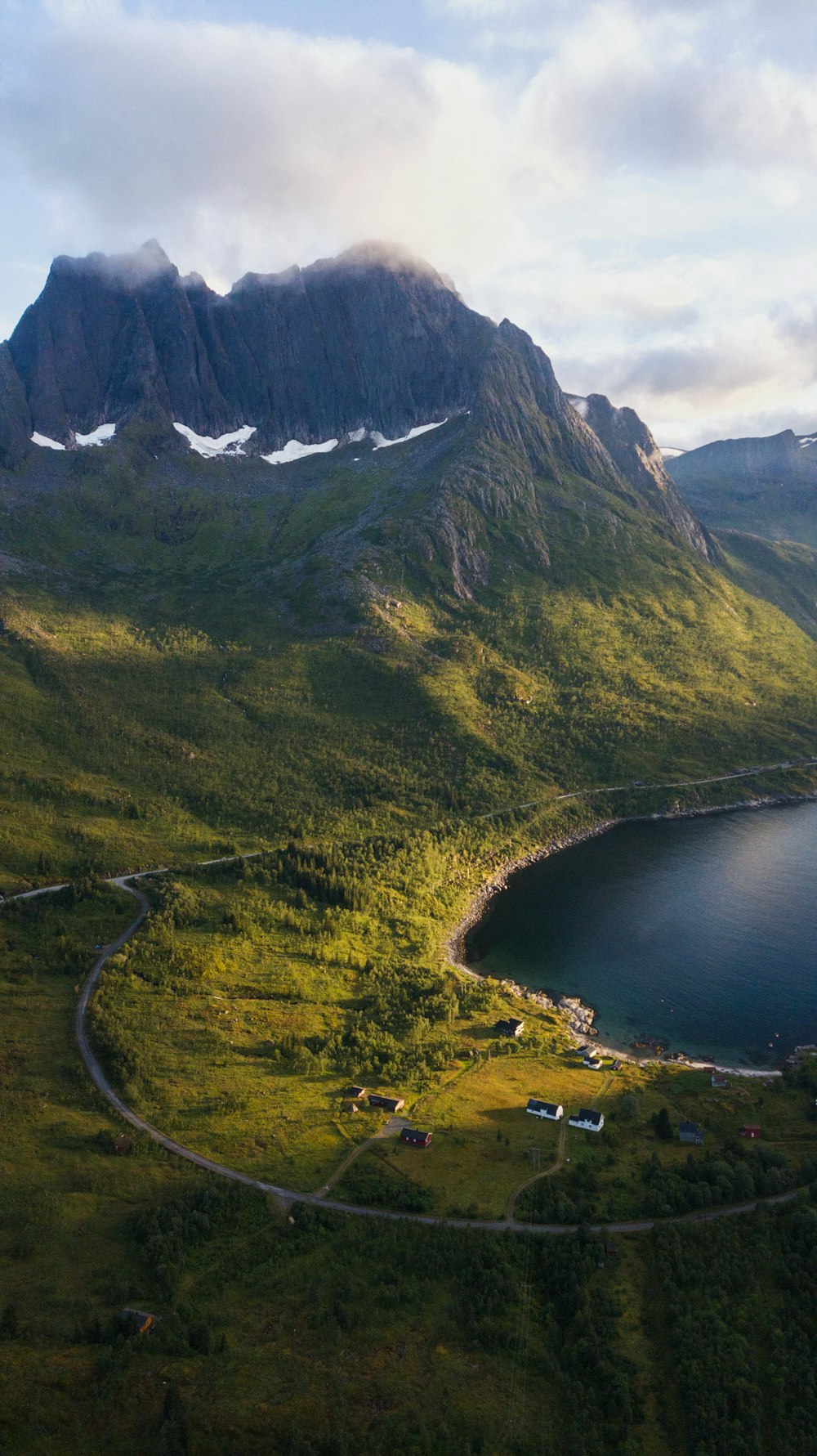 a road going through a valley between mountains