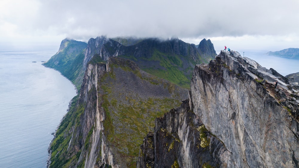 a group of people on a cliff