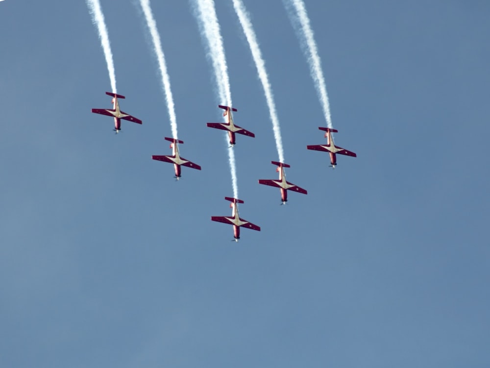 a group of airplanes flying in formation