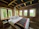 Cozy rustic bedroom featuring a solid slat support storage bed with soft natural light.