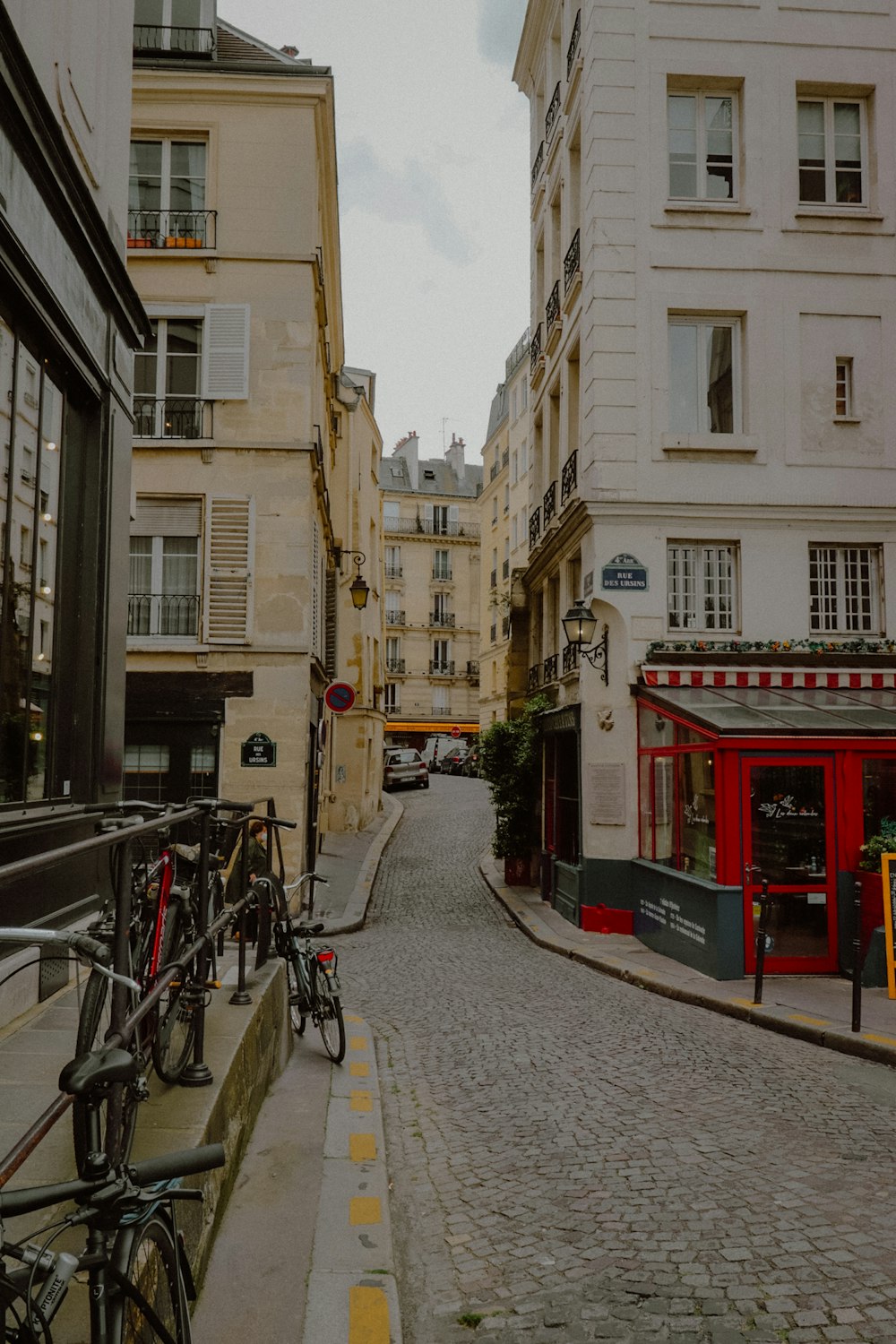 a city street with bicycles parked on the side