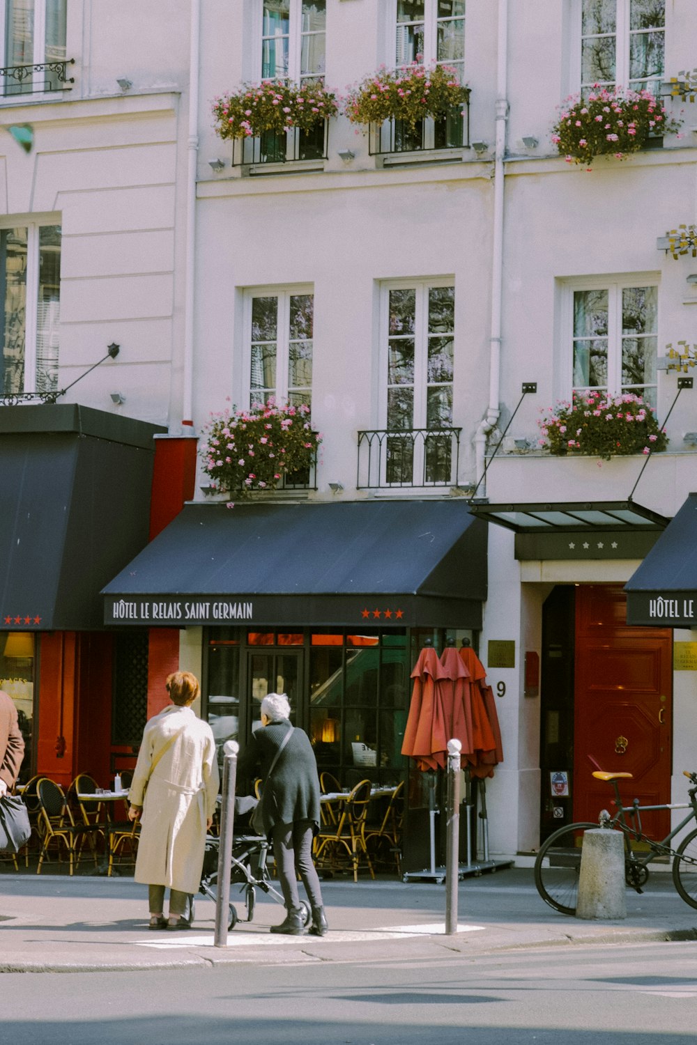 a couple of people stand outside a building