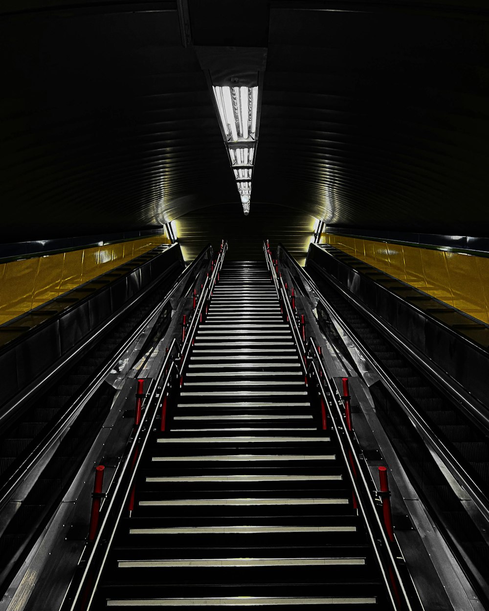 a long escalator in a tunnel