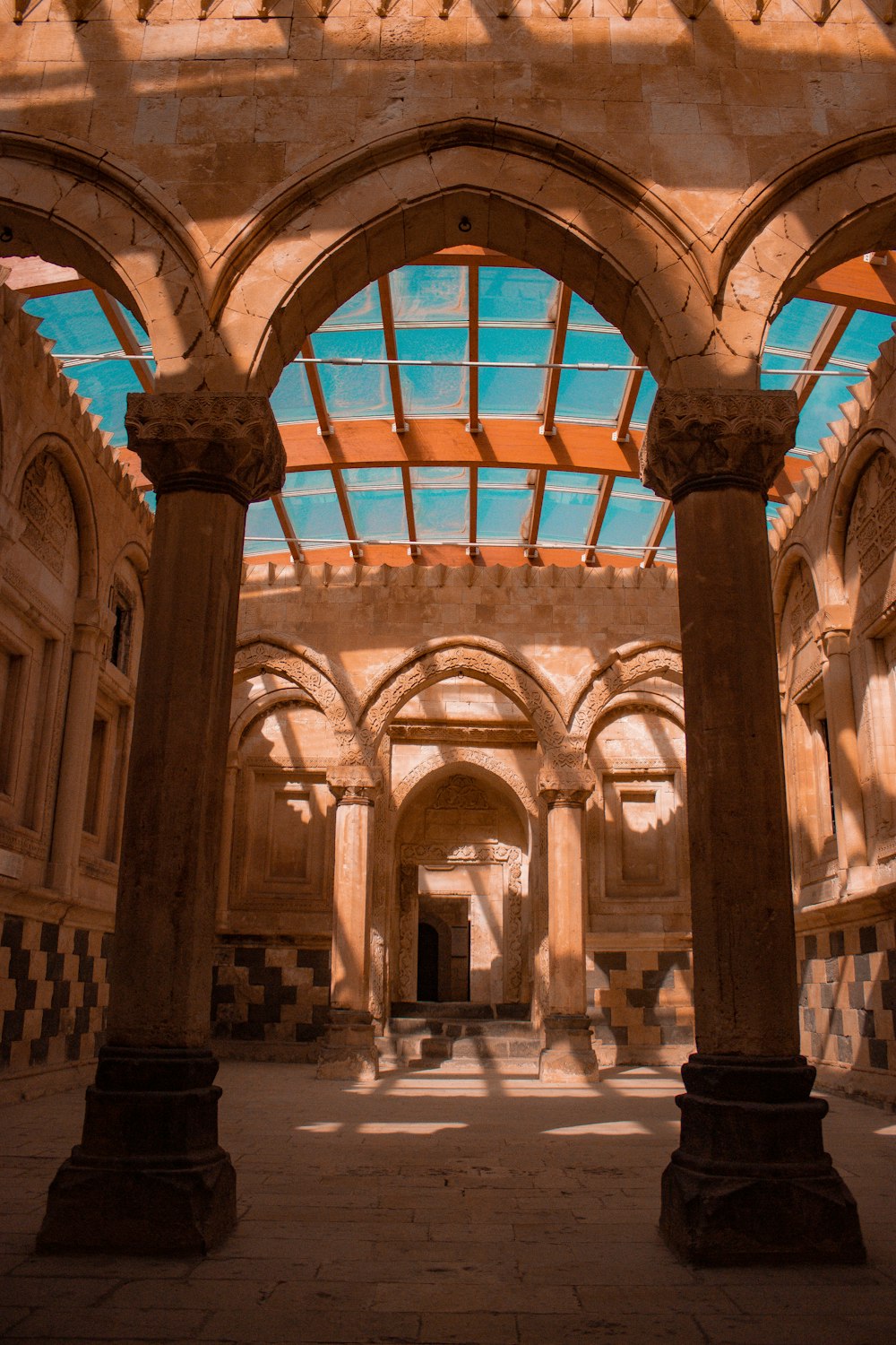 a large building with columns and a large arched window