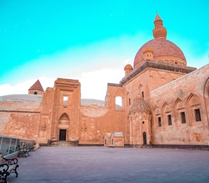 a large brick building with a domed roof