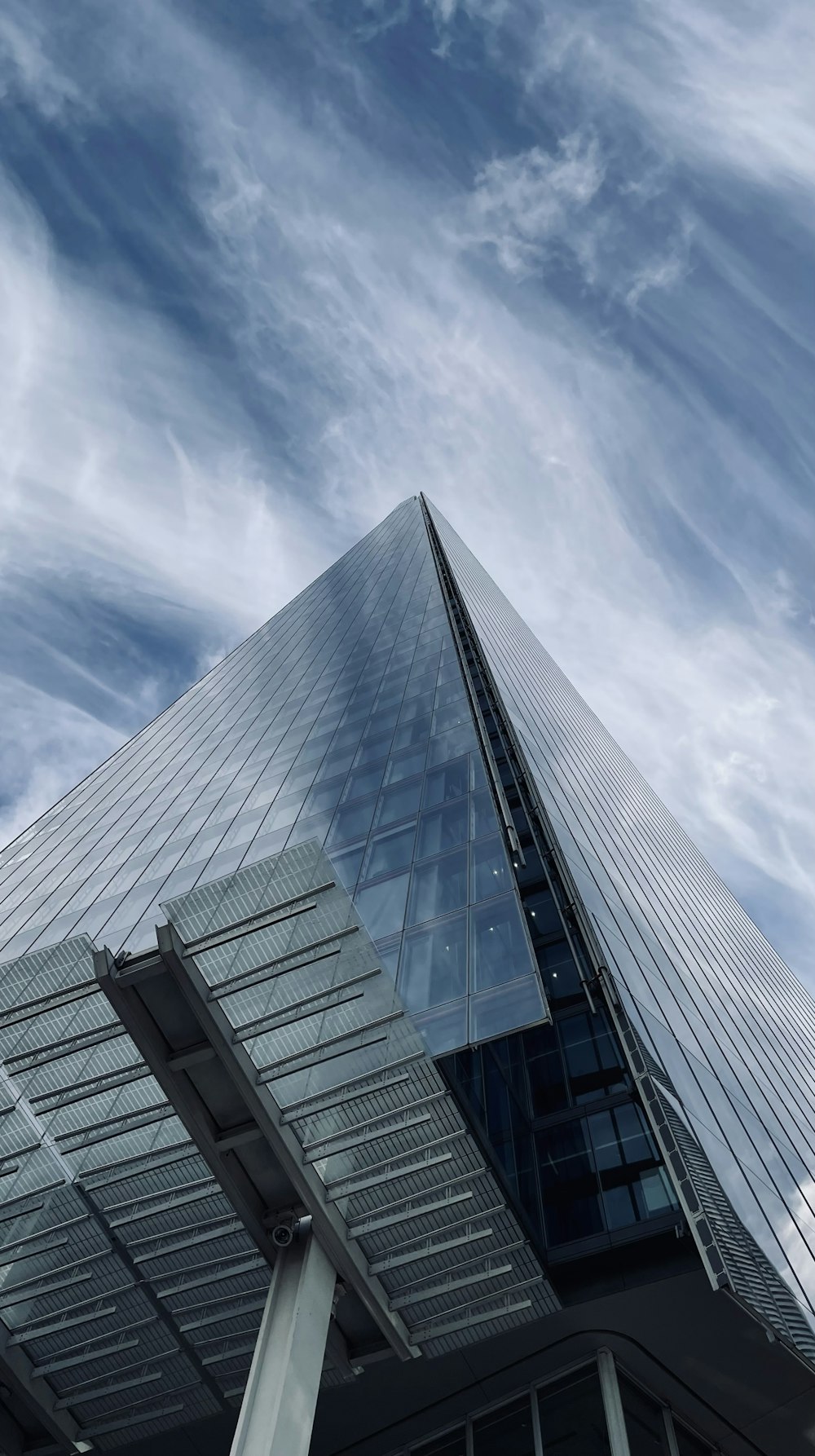 a tall building with glass windows