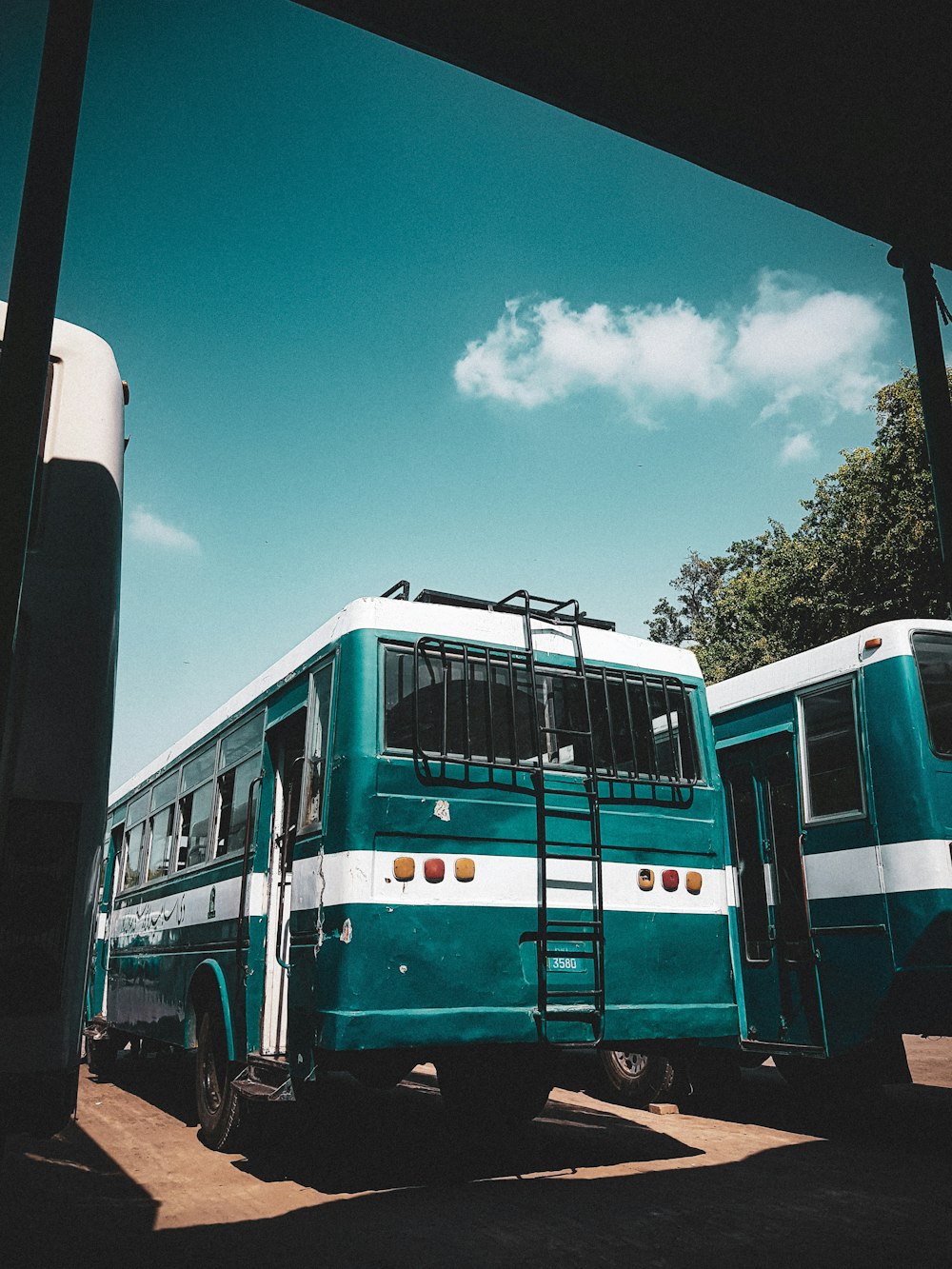 a couple of buses parked next to each other