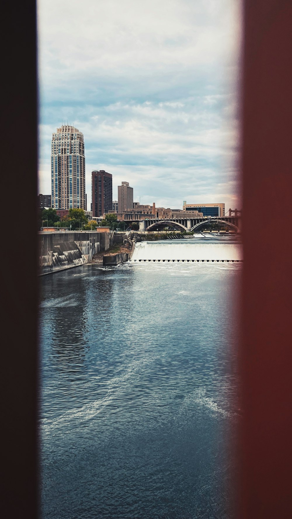 a body of water with buildings in the background