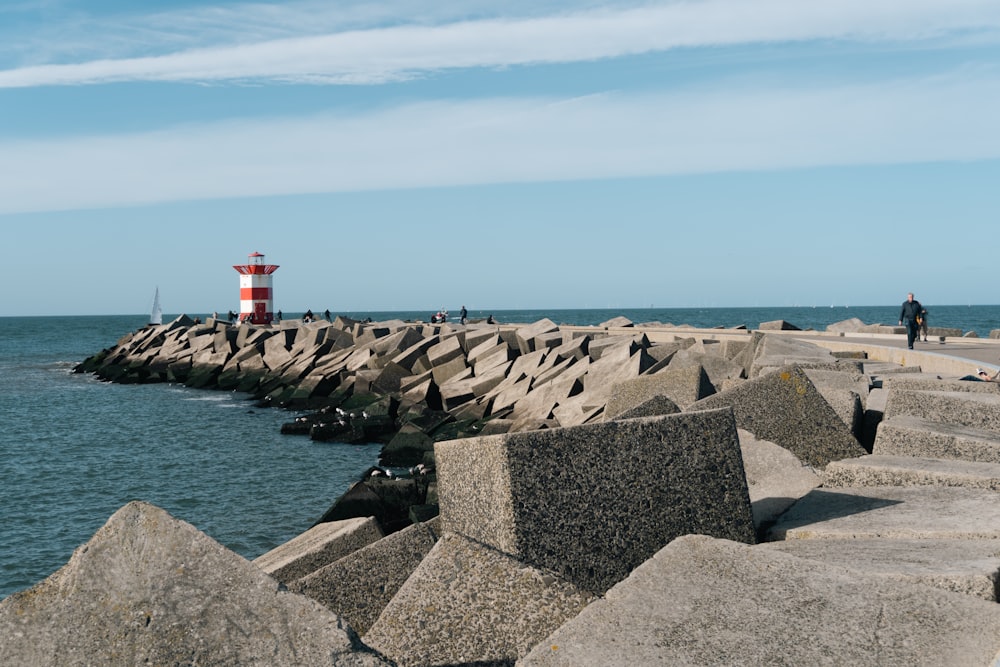 a lighthouse on a rocky beach