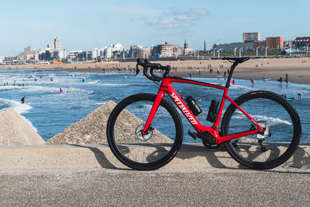 a bicycle parked on a beach