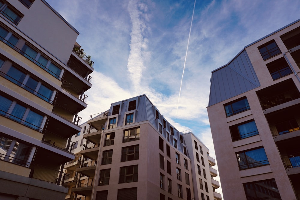 a group of buildings with balconies and a blue sky