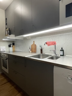 a kitchen with a sink and cabinets
