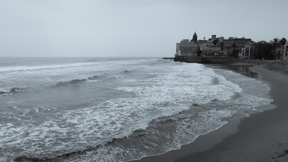 a beach with waves crashing on it