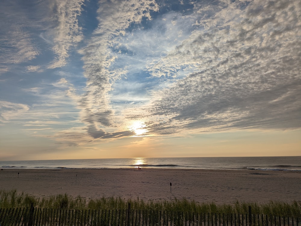 a beach with a sunset