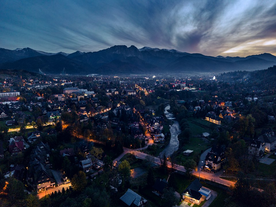 Aerial dusk view of Zakopane town with the Giewont ridge rising behind it
