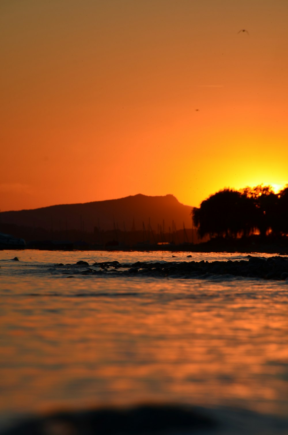 a sunset over a body of water