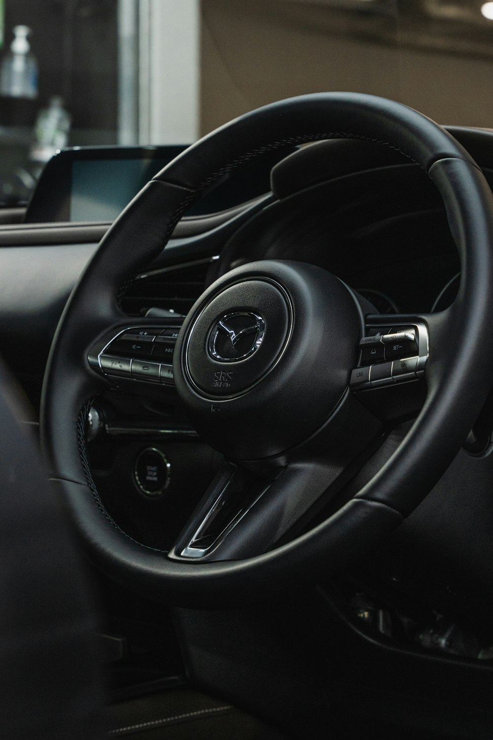 a steering wheel and dashboard of a car