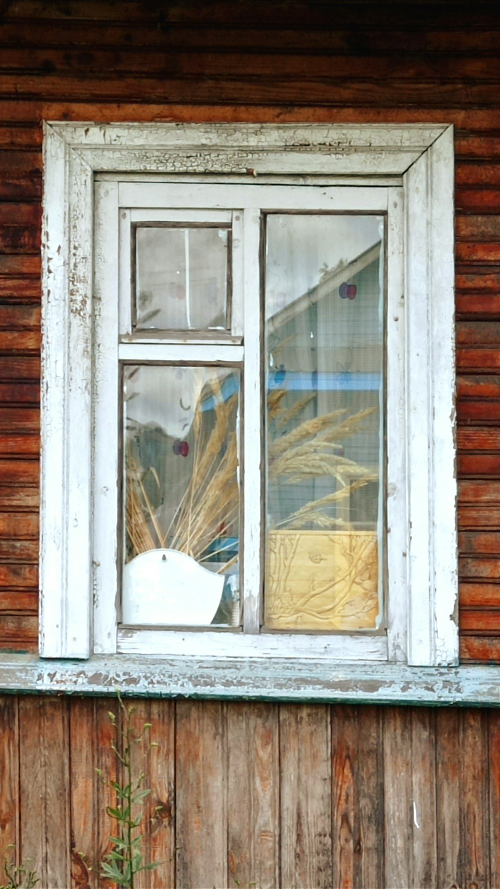 a window with a broken glass