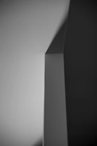 A sleek fashion photography shot with strong contrast and minimal background.