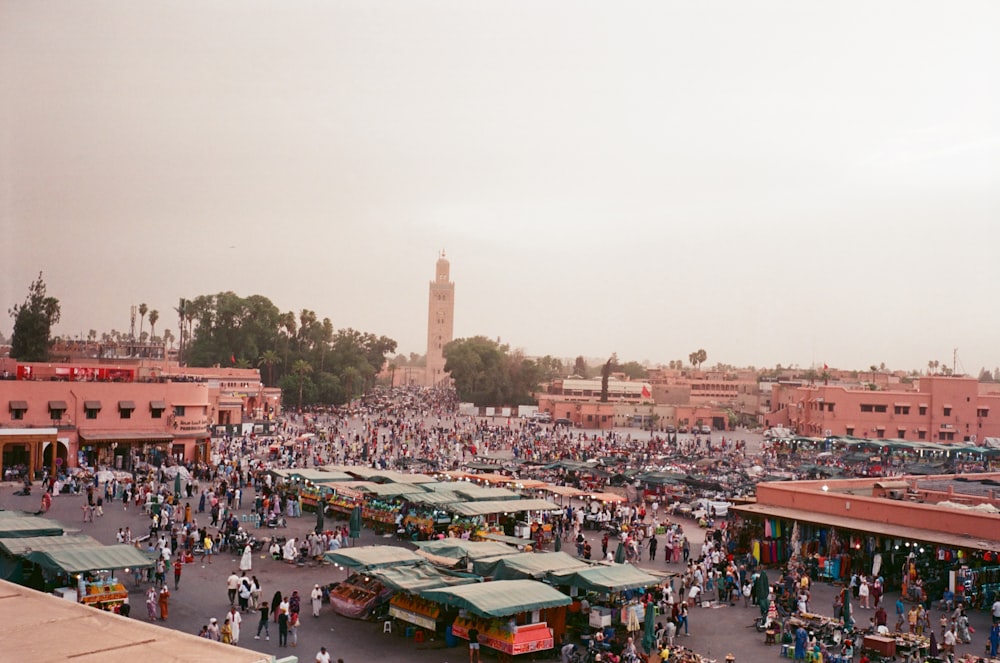 a large crowd of people in a city square