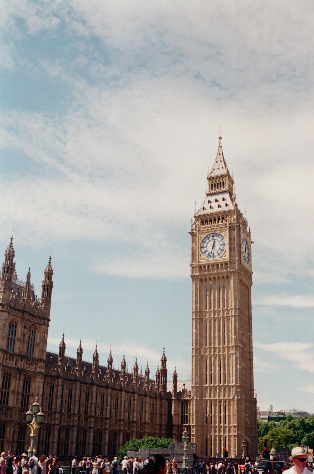 a large clock tower stands tall with Big Ben in the background