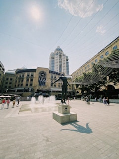 a statue of a man is in the middle of a square