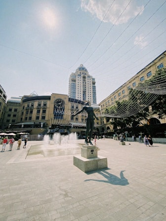 a statue of a man is in the middle of a square