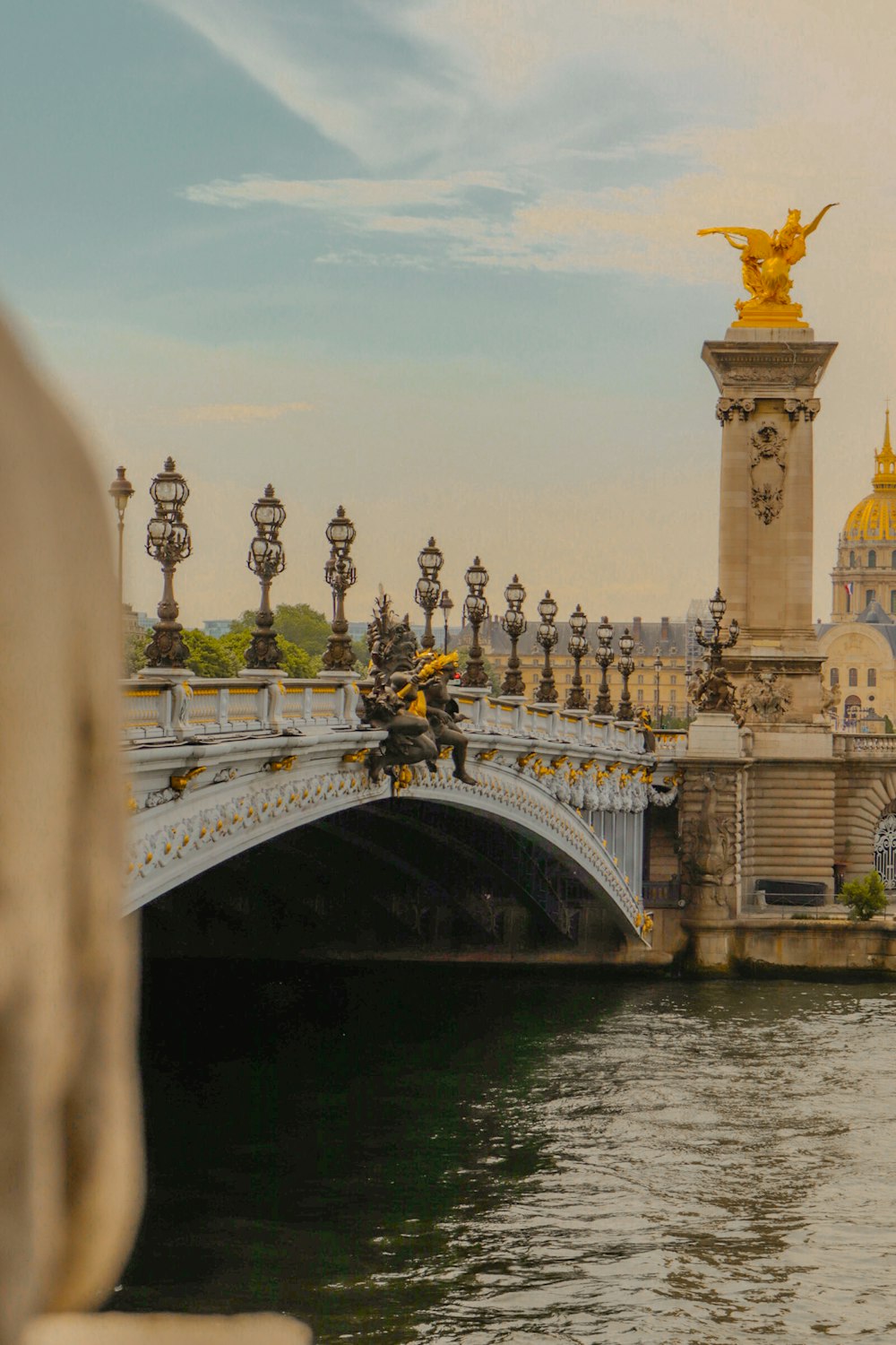 a bridge with statues on it