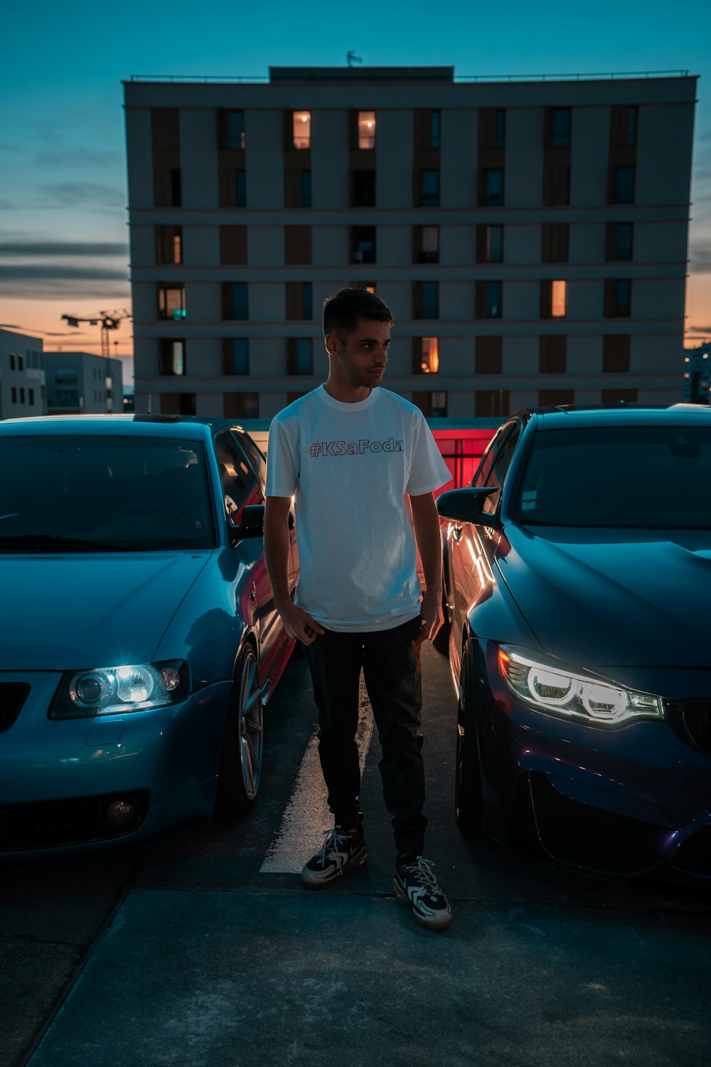 a man standing next to a car