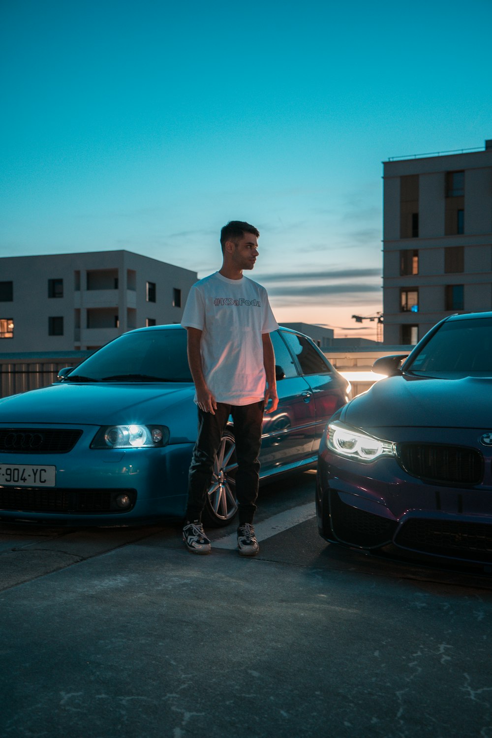 a man standing next to a car