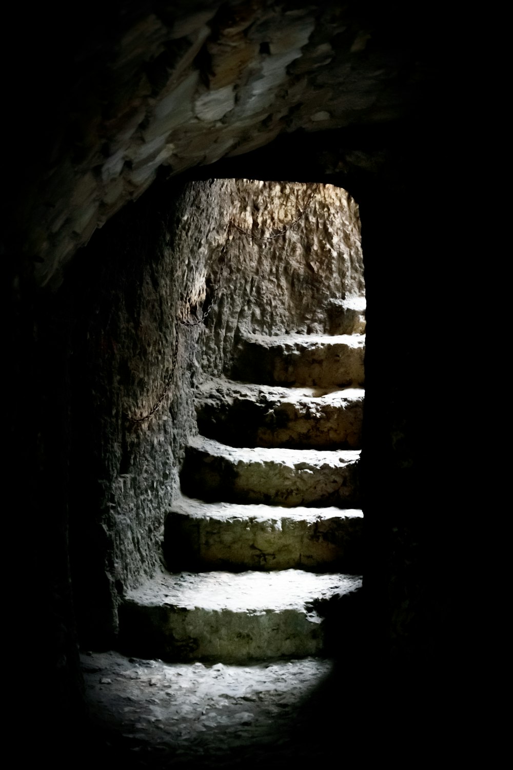 a stone wall with a hole in it