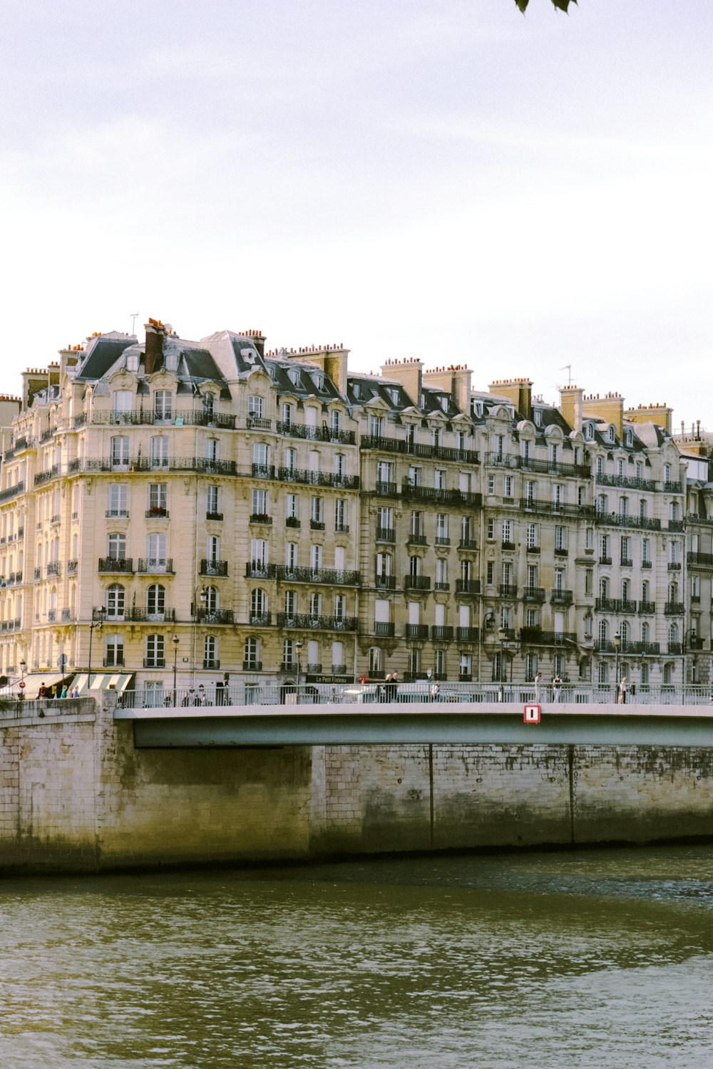 a bridge over a river with buildings on either side of it