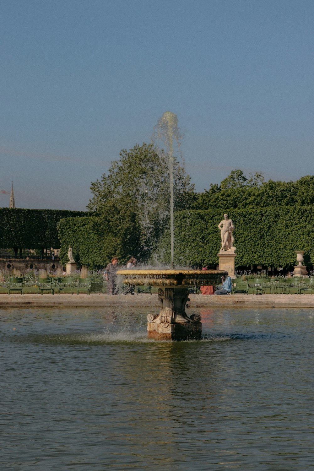a fountain in a pond