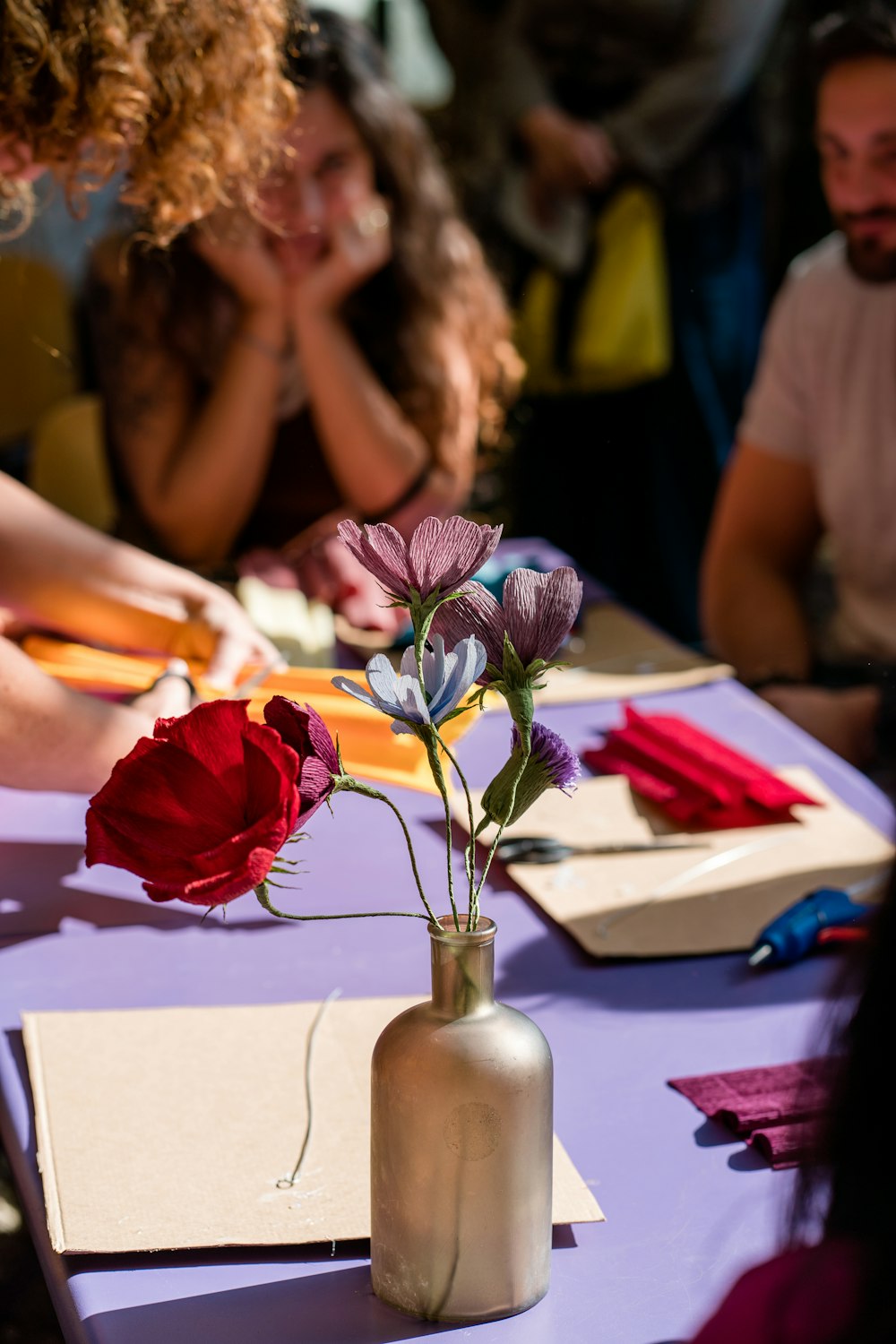 a vase of flowers on a table