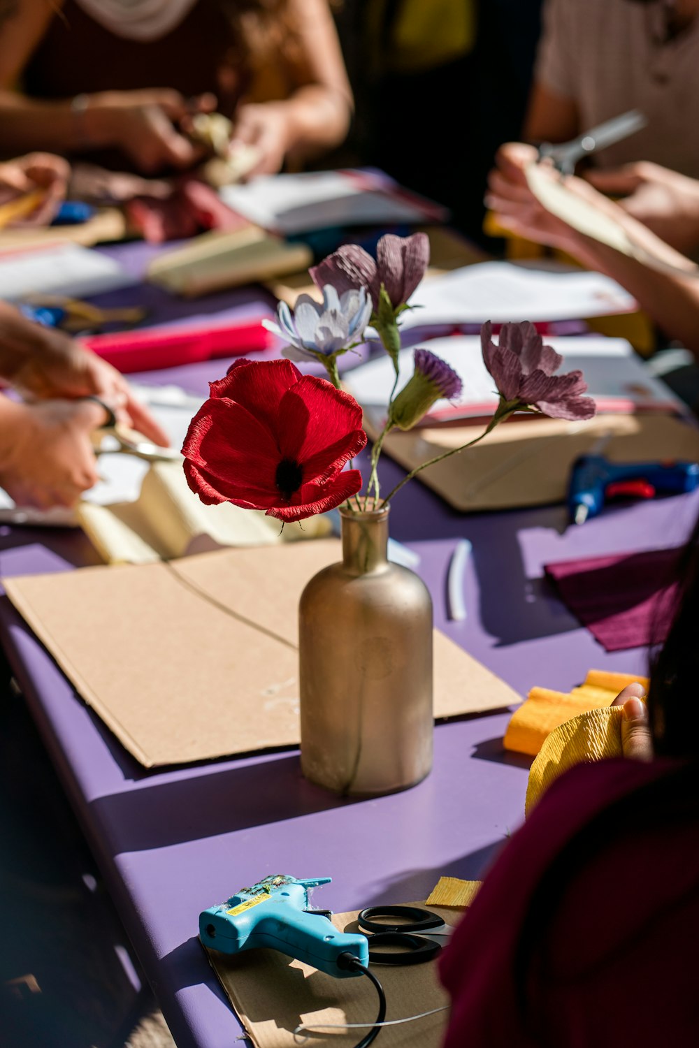 a vase with flowers on a table