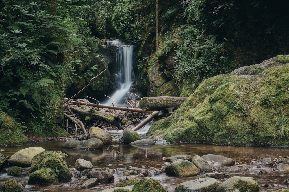 a waterfall over a rocky river